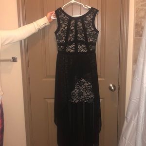 A black long in the back, short in the front dress